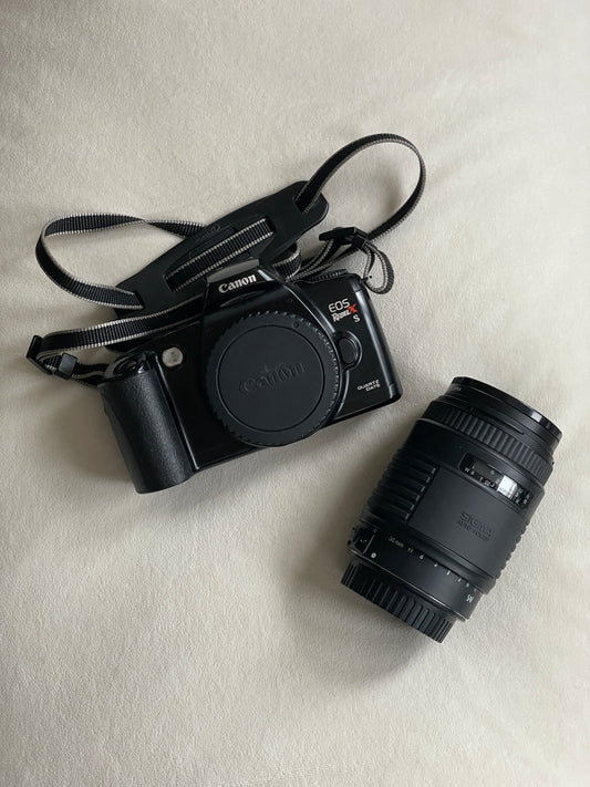 Canon EOS Rebel X S Quartz Date 35mm Film Camera Bundle with Sigma 35-135mm f/4-5.6 lens