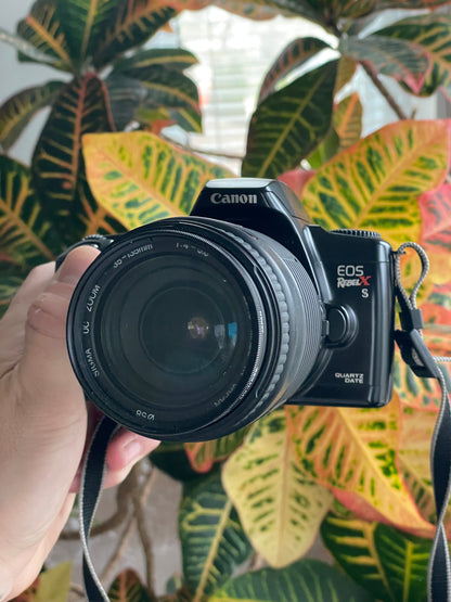Canon EOS Rebel X S Quartz Date 35mm Film Camera Bundle with Sigma 35-135mm f/4-5.6 lens