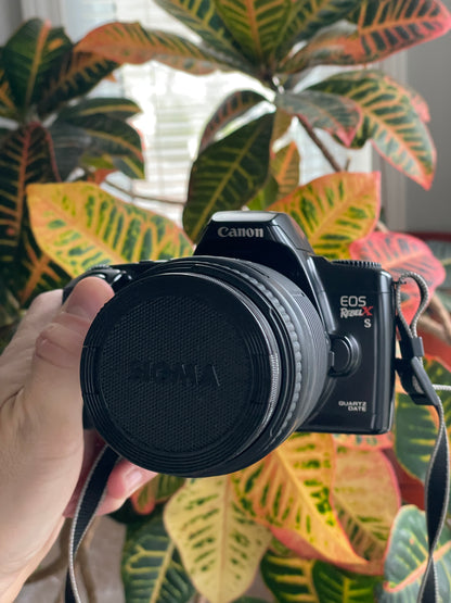 Canon EOS Rebel X S Quartz Date 35mm Film Camera Bundle with Sigma 35-135mm f/4-5.6 lens
