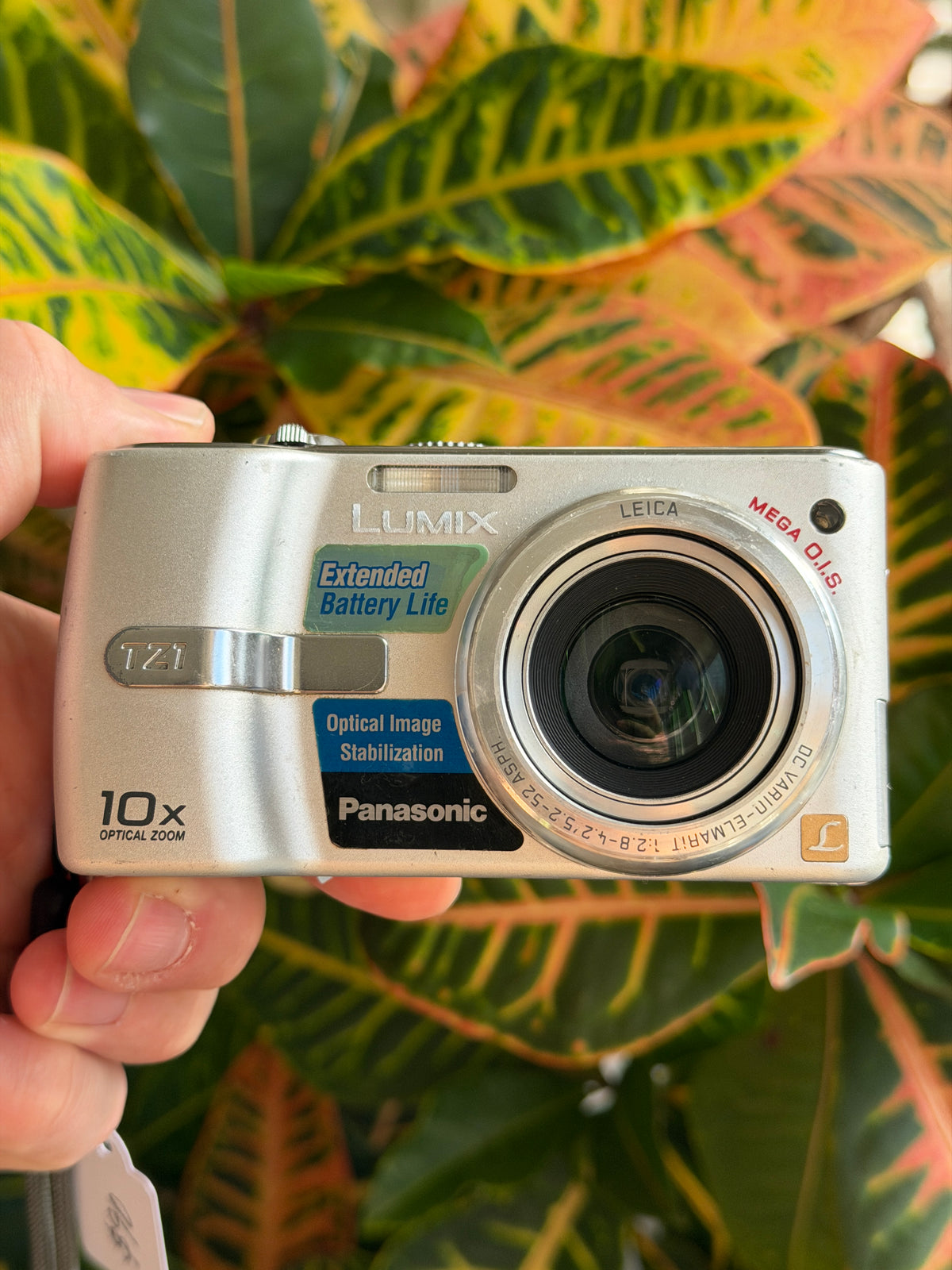 Panasonic Lumix DMC-TZ1 digital camera held in hand