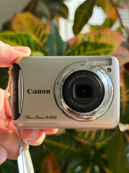 Canon PowerShot A495 digital camera held in hand