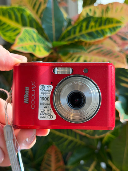 Nikon Coolpix L18 digital camera held in hand