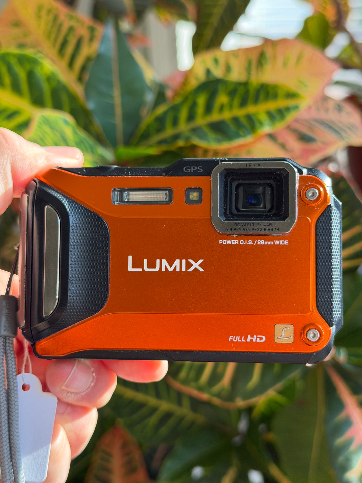 Panasonic Lumix DMC-TS5 digital camera held in hand