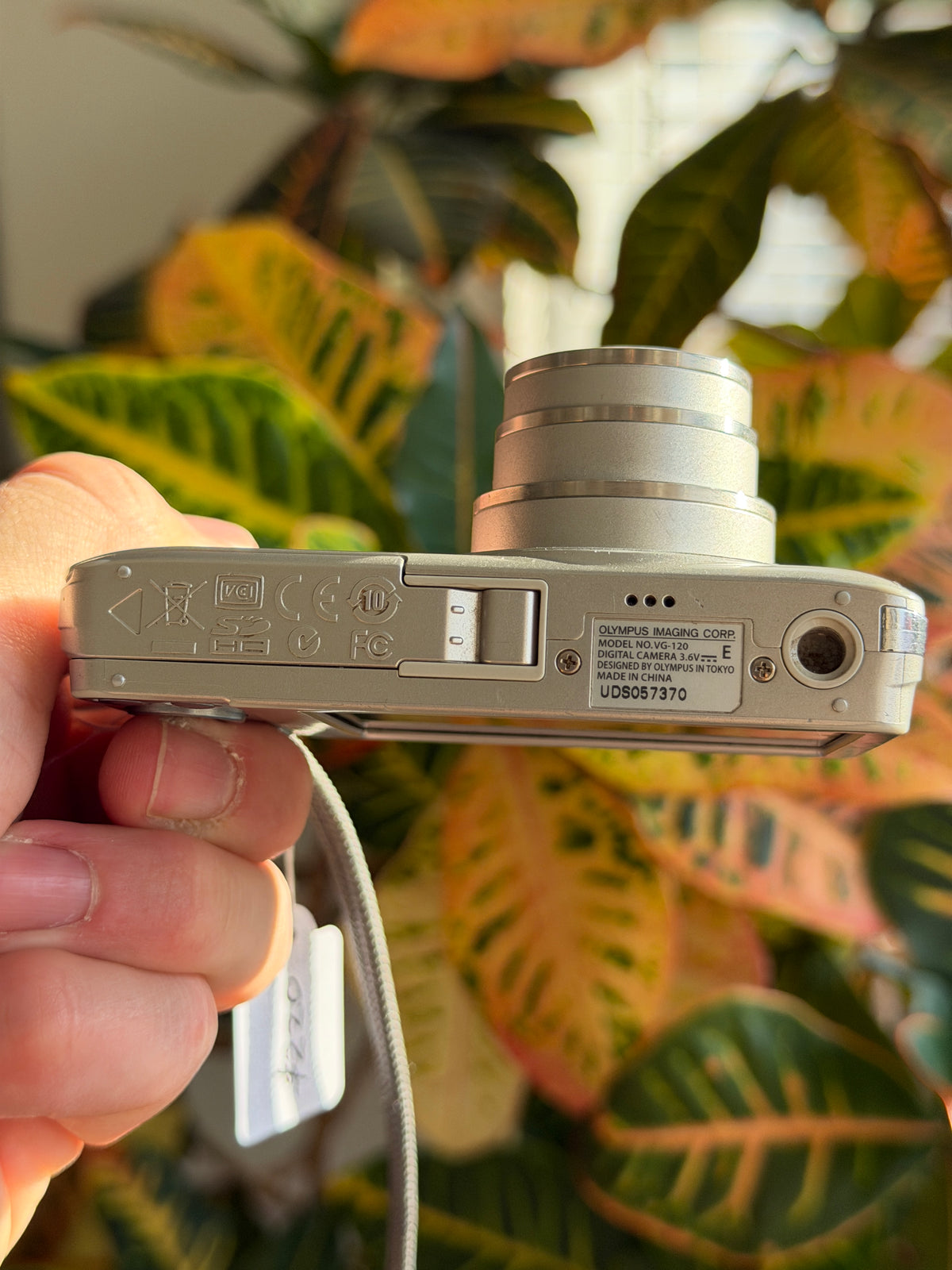 Olympus VG-120 digital camera bottom view